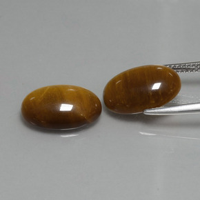 Натуральный коричневый tiger's eye 9,04 карата огранка овал, непрозрачный