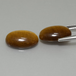 Натуральный коричневый tiger's eye 9,19 карата огранка овал, непрозрачный