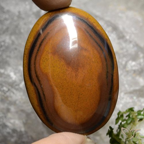 Натуральный коричневый tiger's eye 92,65 карата огранка овал, непрозрачный
