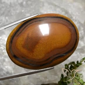 Натуральный коричневый tiger's eye 92,65 карата огранка овал, непрозрачный