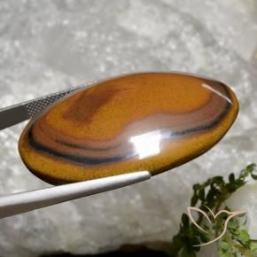 Натуральный коричневый tiger's eye 92,65 карата огранка овал, непрозрачный