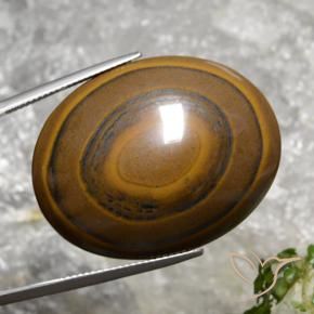 Натуральный коричневый tiger's eye 89,36 карата огранка овал, непрозрачный