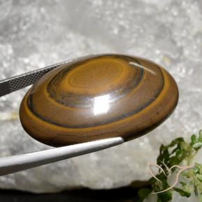 Натуральный коричневый tiger's eye 89,36 карата огранка овал, непрозрачный