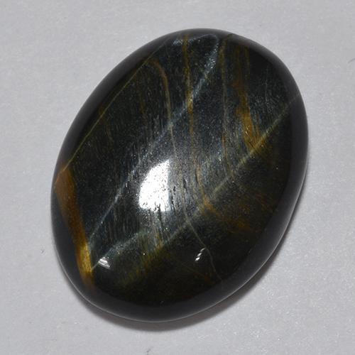 Натуральный многоцветный tiger's eye 11,75 карата огранка овал, непрозрачный