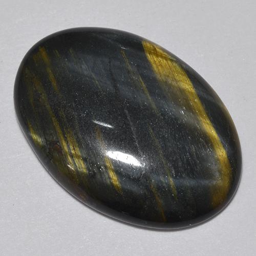 Натуральный многоцветный tiger's eye 9,44 карата огранка овал, непрозрачный
