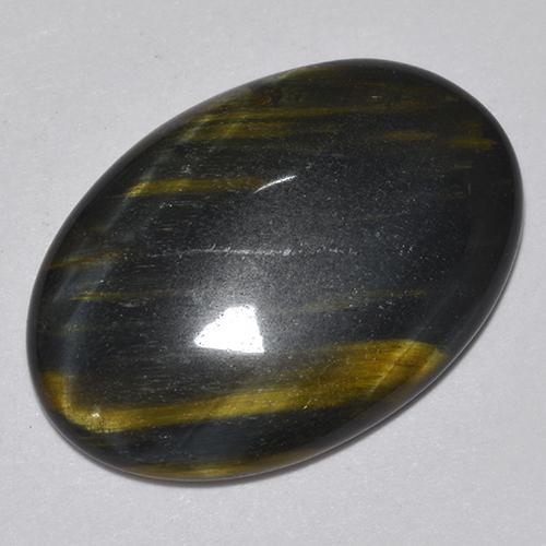 Натуральный многоцветный tiger's eye 9,44 карата огранка овал, непрозрачный