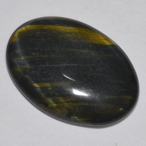 Натуральный многоцветный tiger's eye 9,44 карата огранка овал, непрозрачный
