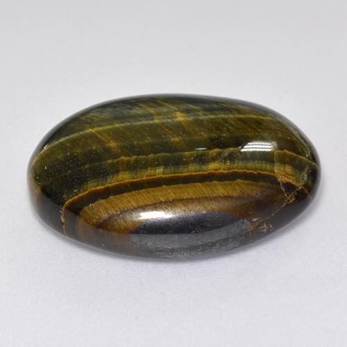 Натуральный многоцветный tiger's eye 12,92 карата огранка овал, непрозрачный