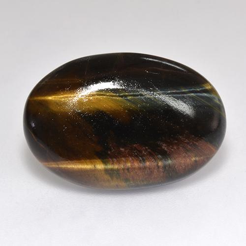 Натуральный многоцветный tiger's eye 18,46 карата огранка овал, непрозрачный