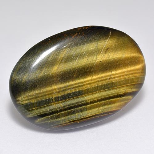 Натуральный коричневый tiger's eye 23,65 карата огранка овал, непрозрачный