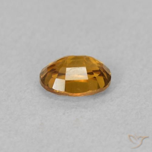 0.63 карата, натуральный Коричневато-оранжевый Циркон, Овал, VVS-VS